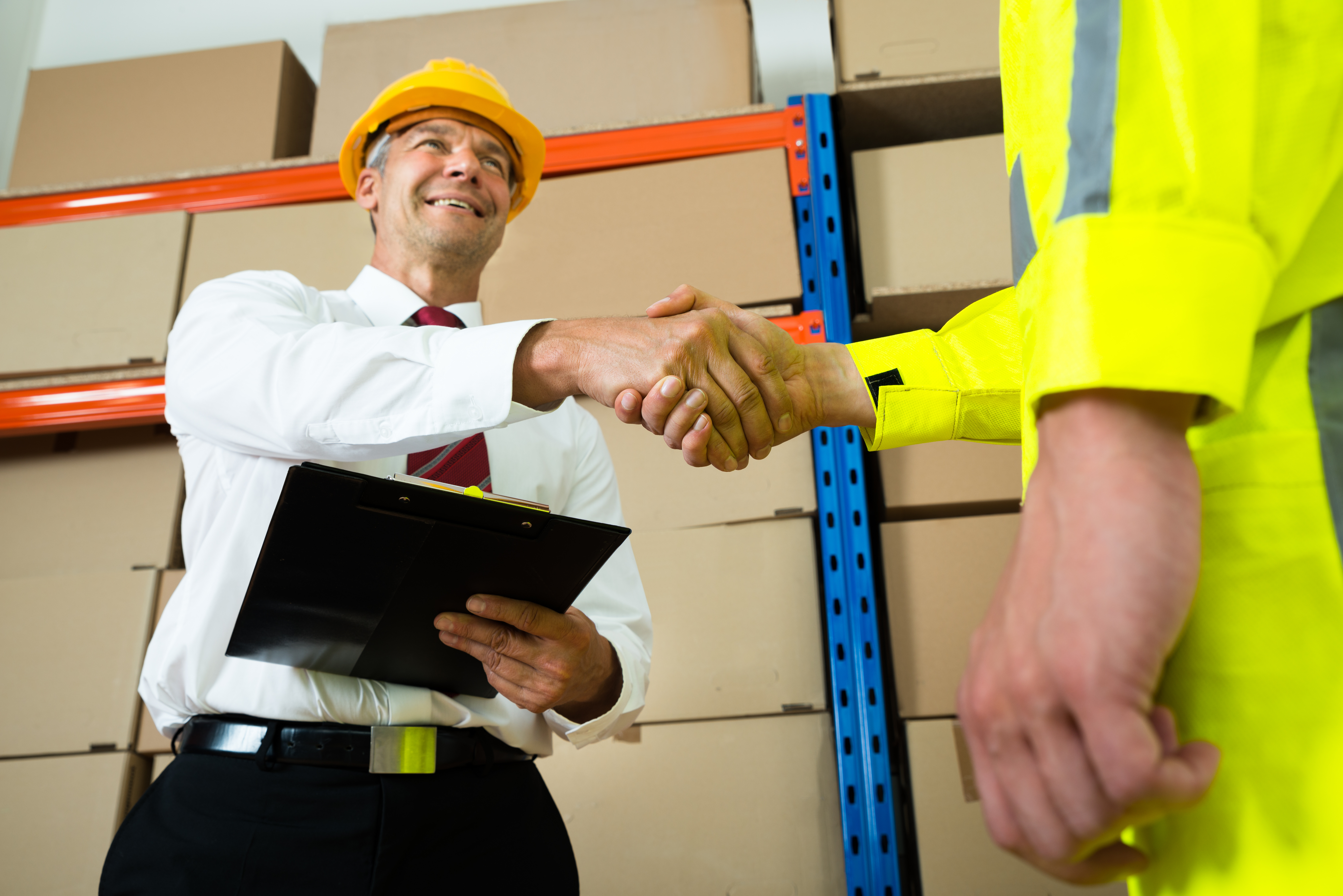 Happy Manager Shaking Hands With Warehouse Worker Happy Manager Shaking Hands With Warehouse Worker